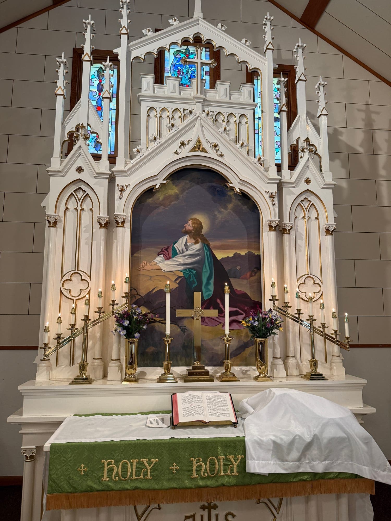 The white Gothic altar and reredos of Calvary Lutheran Church